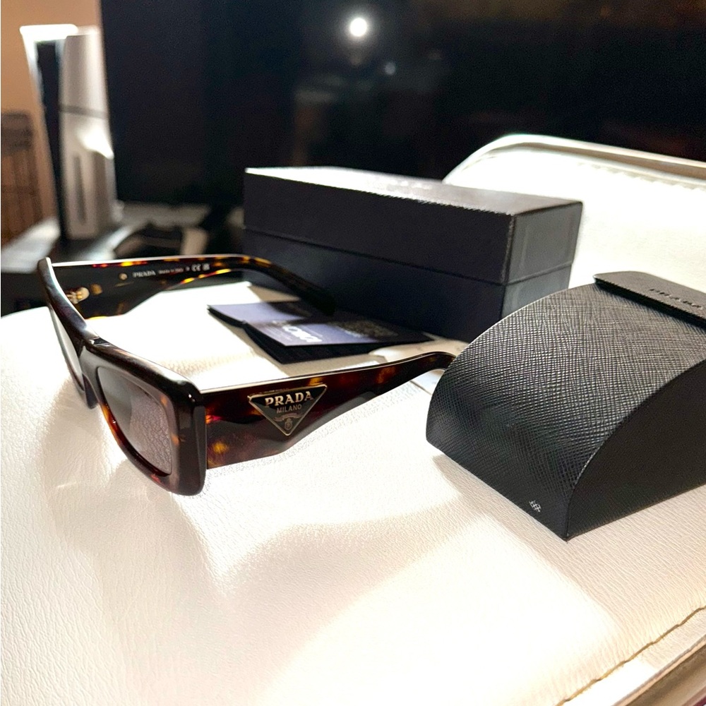 100% authentic Prada sun glasses. Original box and receipt included.